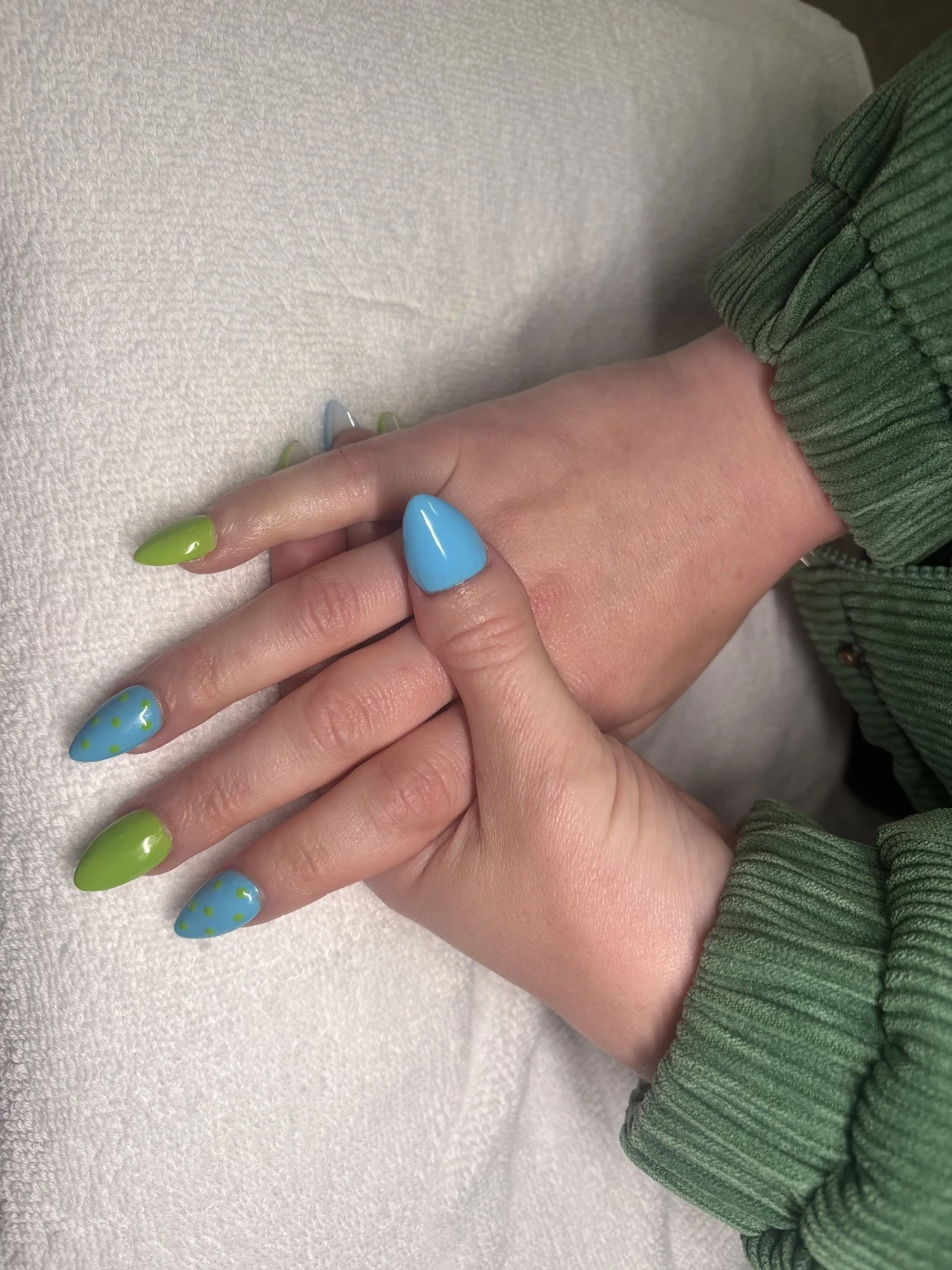 Carlita’s original nail work: blue + green dots